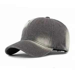 Faded black washed denim baseball cap with adjustable strap and vintage sun protection style