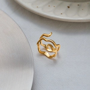 Luxury gold irregular wave ring in polished stainless steel with liquid metal texture