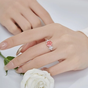 Detail of S925 silver ring featuring pink cushion-cut gem and white marquise diamonds