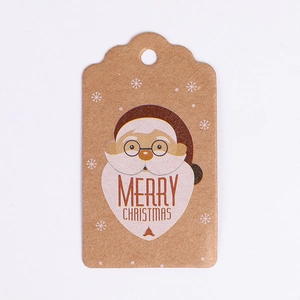 Detail of kraft paper gift tag featuring cartoon Santa Claus and Merry Christmas text