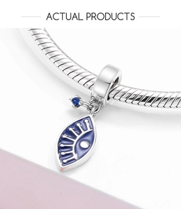 Macro shot of S925 sterling silver blue evil eye charm with enamel and zircon detail
