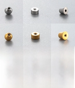 Macro shot of stainless steel screw-back ear studs in gold and silver plating finishes