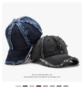 Detailed view of vintage washed denim baseball cap with white frayed contrast stitching