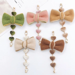 DIY plush heart bow pendants in green, pink, and brown for jewelry making and phone cases