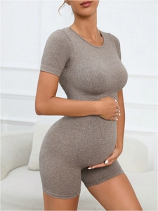 Detail of brown ribbed maternity yoga set showing high elasticity and seamless fabric