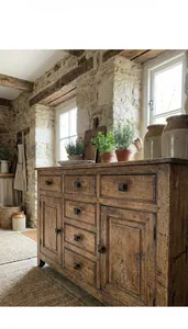 Detail of vintage iron handle on rustic wood drawer with distressed natural texture