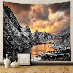 Detail of bohemian tapestry featuring snow-capped mountains and sunset lake reflection