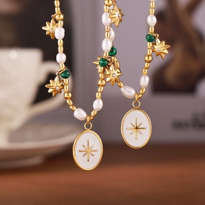 French pearl beaded necklace with star pendant on a warm lifestyle background