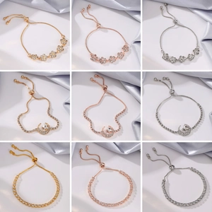 Detailed view of adjustable tassel bracelets with crystal floral and moon designs in three colors