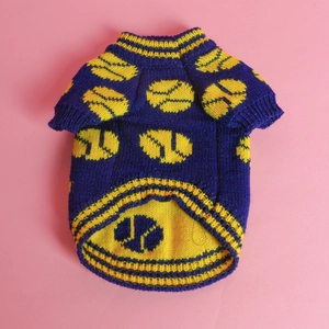 Detail of dark blue dog sweater with yellow tennis ball pattern and ribbed knit texture