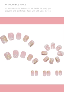 Detail of pink press-on nails featuring 3D silver bows and glitter gradient designs