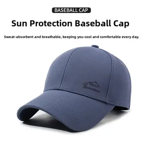 Close-up of navy blue twill cotton baseball cap featuring mountain embroidery details