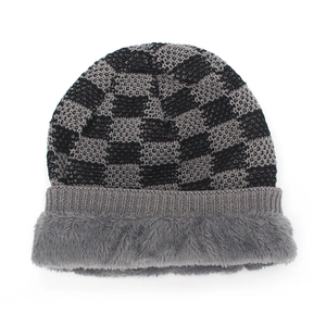 Winter knitted beanie with black and grey checkerboard pattern and plush fleece lining