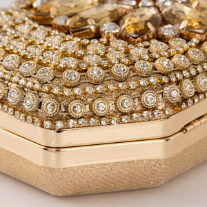 Luxurious gold evening clutch bag with sparkling rhinestones and crystal gemstone inlay