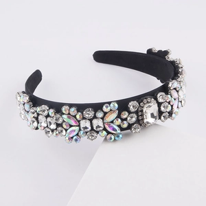 Macro shot of luxury baroque headband featuring multi-shape crystals on black velvet