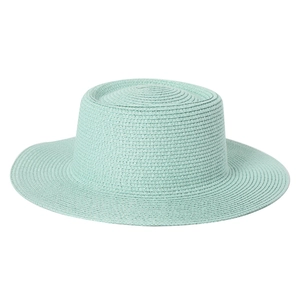 Detail of mint green woven texture on a high crown boater straw hat for sun protection