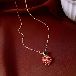 Exquisite 14k gold plated apple pendant necklace with red crystals and green leaf detail