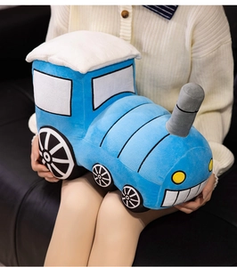 Macro shot of soft plush train toy with blue fabric and yellow window details