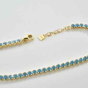 Detail of S925 sterling silver lobster clasp and extension chain with blue stone