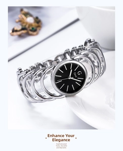 Close-up of Gedi silver bracelet watch with black dial on elegant white ceramic plate