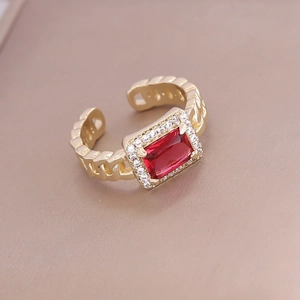 Vintage gold adjustable ring with a rectangular red zircon and sparkling diamond halo