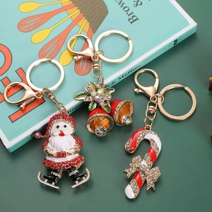 Christmas rhinestone keychains with Santa Claus, bells and candy cane designs