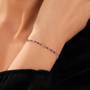 Luxury rainbow tennis bracelet with multi-color rhinestones on a delicate gold band