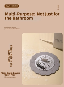 Macro view of flower-shaped floor drain cover filtering hair in bathroom sink
