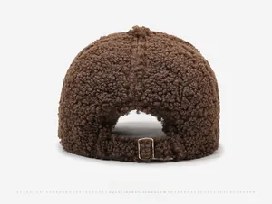 Close-up of the back of a dark brown teddy fleece baseball cap with metal buckle