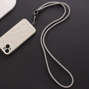 Detail of white wave texture phone case with luxurious sparkling rhinestone lanyard strap