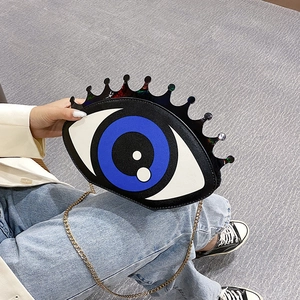 Creative eye-shaped crossbody bag with crown detail and gold chain strap for women