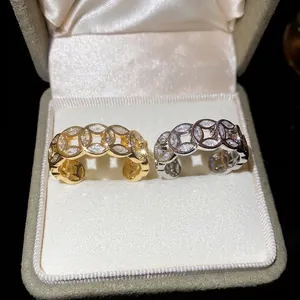 18k gold plated open rings with hollow coin design and pave cubic zirconia accents