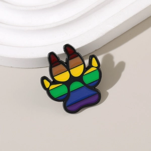 Rainbow enamel animal paw print brooch pin in colorful metal finish on neutral background