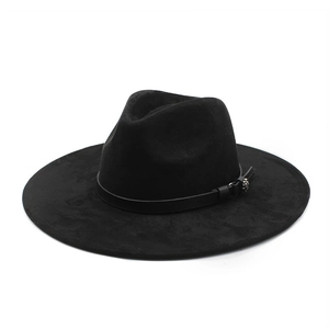 Close-up of black suede fedora hat featuring a slim leather band and metallic buckle detail