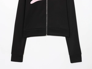 Detail of silver metal zipper and premium black knit fabric texture on the sport jacket