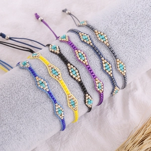 Handmade Bohemian seed bead woven bracelets in colorful patterns with adjustable cords