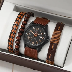 Detail view of men's watch and beaded bracelet set in a gift box on a white cushion