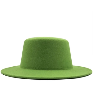 Detailed close-up of grass green flat top fedora hat with fine felt texture and wide brim