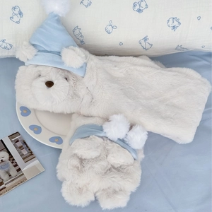 Cute white plush bear scarf with a blue knitted sleeping cap for winter warmth