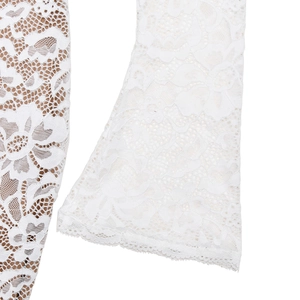 Close-up of intricate white lace embroidery and fabric texture on this slim fit dress