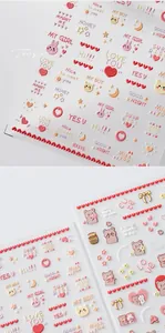 Detail shot of pink and red 3D embossed nail art stickers with cute bears and hearts