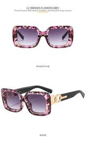 Detail of square frame sunglasses with purple marble texture and golden link hardware
