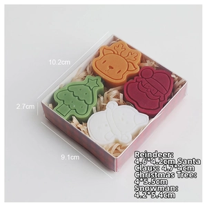 Macro view of Christmas scent candles set with reindeer and tree shapes in a gift box