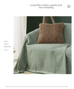 Detail of light green waffle weave sofa cover made of soft long-fiber cotton material