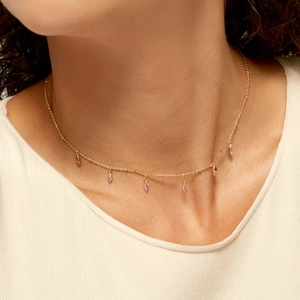 S925 sterling silver necklace with pink marquise cut zircon stones worn by a model