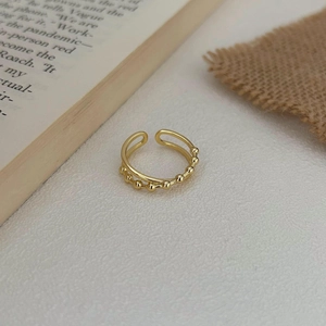 Minimalist gold dual-layer ring with polished finish and beaded texture design