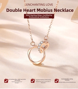 Close-up of S925 sterling silver Mobius loop and diamond-set heart interlocking pendant