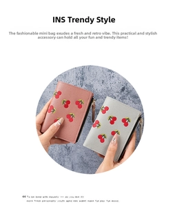 Close-up of mini cherry embroidery wallets in pink and gray with litchi grain texture