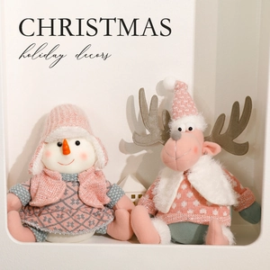 Pink and mint green plush Christmas reindeer and snowman figurines in a cozy Nordic style