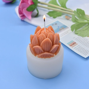 3D lotus shaped candle in terracotta red color on a white base for DIY candle making
